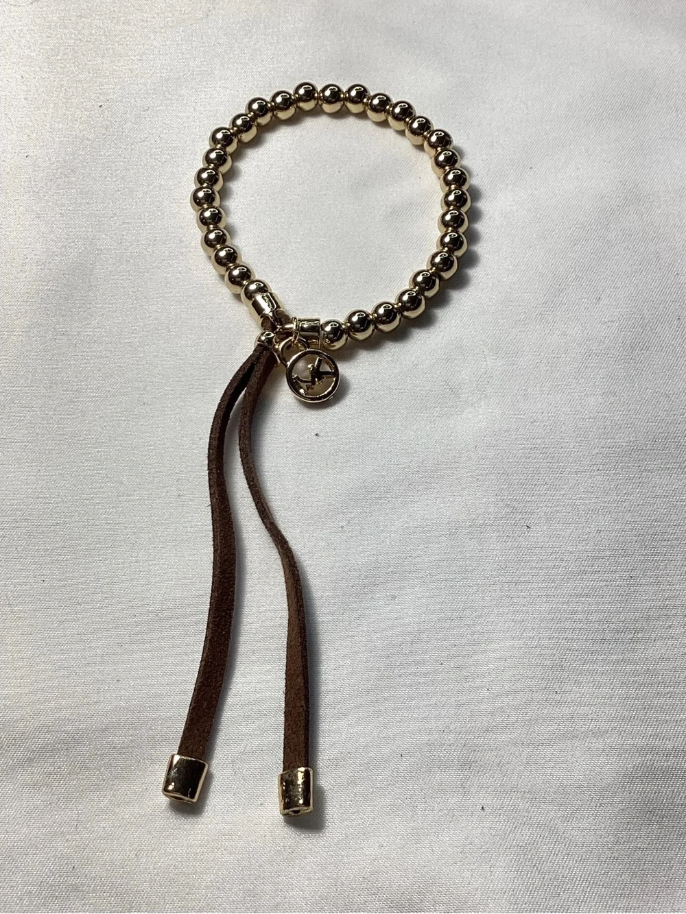 Michael Kors NWT and Dust Bag Gold-Tone Beaded Brown Suede Logo Charm Bracelet